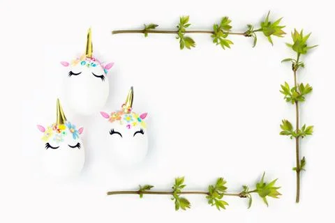 Easter concept. Unicorns in the shape of an egg and a frame of twigs. Happy e Stock Photos