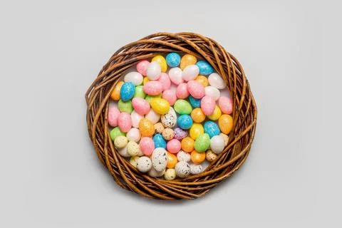 Easter concept. wreath with easter eggs on a light background Stock Photos