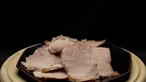 Easter cooked ham sliced on a plate Stock Footage 106754761