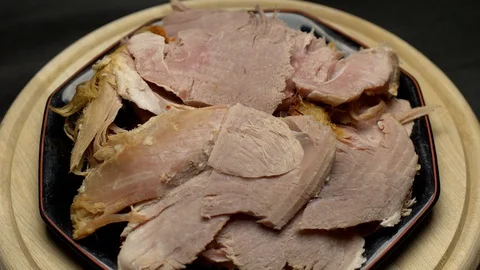 Easter cooked ham sliced on a plate Stock Footage 106754924