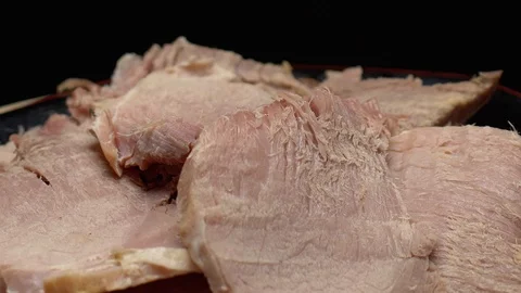 Easter cooked ham sliced on a plate Stock Footage 117343885