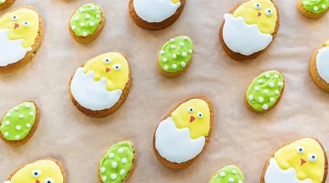 Easter cookies on baking paper. Creative ideas of family cooking with kids. Stock Photos