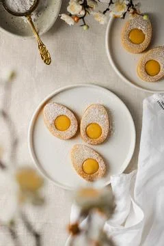 Easter cookies in the form of Easter egg with powdered sugar and lemon cream  Stock Photos