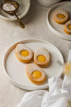 Easter cookies in the form of Easter egg with powdered sugar and lemon cream  Fotos de archivo