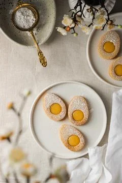 Easter cookies in the form of Easter egg with powdered sugar and lemon cream  Stock Photos