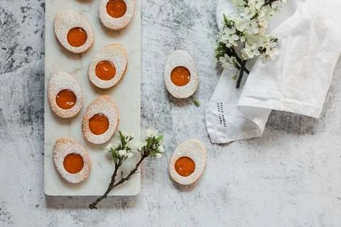 Easter cookies in the form of Easter egg with powdered sugar and lemon cream  Stock Photos