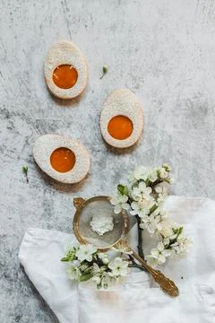 Easter cookies in the form of Easter egg with powdered sugar and lemon cream  Stock Photos