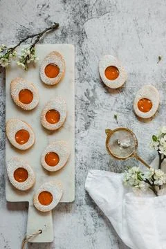 Easter cookies in the form of Easter egg with powdered sugar and lemon cream  Stock Photos