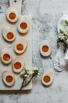 Easter cookies in the form of Easter egg with powdered sugar and lemon cream  Stock Photos