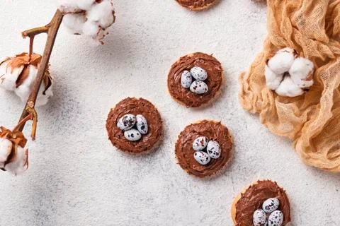 Easter  cookies in shape of nest with eggs Stock Photos