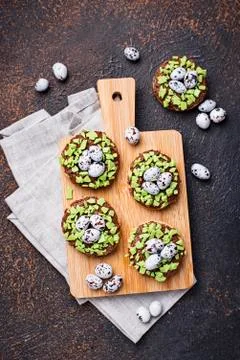 Easter  cookies in shape of nest with eggs Stock Photos