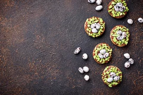 Easter  cookies in shape of nest with eggs Stock Photos