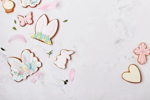 Easter cooking baking background with pastel colored Easter cookies. Wooden Stock Photos