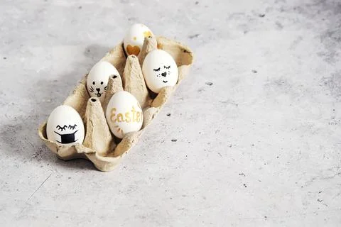 Easter. Copy space for easter greetings. Smiley eggs. Stock Photos