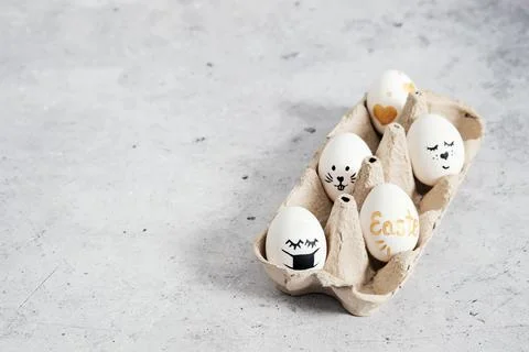 Easter. Copy space for easter greetings. Smiley eggs. Stock Photos