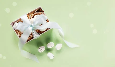 Easter creative layout with Easter eggs in a gift box with lavender blush Stock Photos