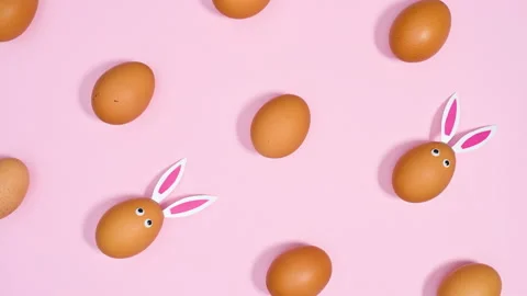 Easter creative pattern with fresh eggs with rabbit ears move. Stop motion Stock Footage 171363916