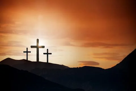 Easter cross on the dawn background Stock Photos