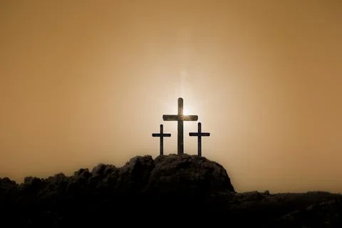 Easter cross on the dawn background Stock Photos
