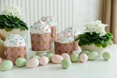 Easter Cupcakes with Eggs and Spring Decorations on White Background Fotos Stock