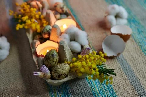 Easter decor, candles, eggs, dried flowers, eggshells Stock Photos