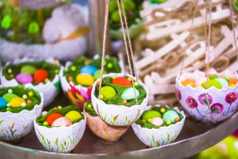 Easter decor, hanging baskets with eggs in the grass, eggshell baskets, Easte Stock Photos