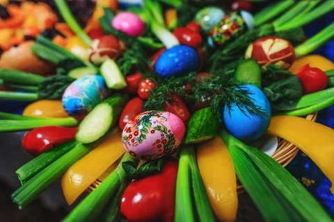 Easter decorated eggs and vegetables flower on holiday homemade table. Creati Stock Photos
