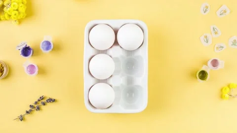 Easter decorated eggs stop motion 4k change color. Minimal easter concept. Top Stock Footage 178479206