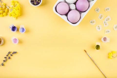 Easter decorated eggs on yellow background. Minimal happy easter concept. Top Stockfoto's