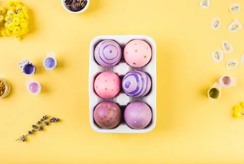 Easter decorated eggs on yellow background. Minimal happy easter concept. Top Stock Photos