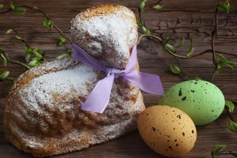 Easter decoration /  easter lamb - cake with purple ribbon, easter green and cre Stock Photos