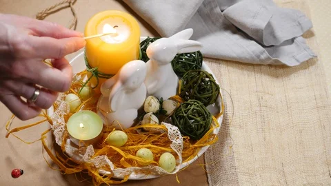 Easter decoration with eggs and burning candles Video stock 128073460