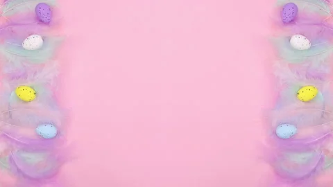 Easter decoration with eggs and feathers appear on left and right. Stop motion Stock Footage 148783013