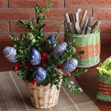 Easter decoration - eggs in basket on the table Stock Photos