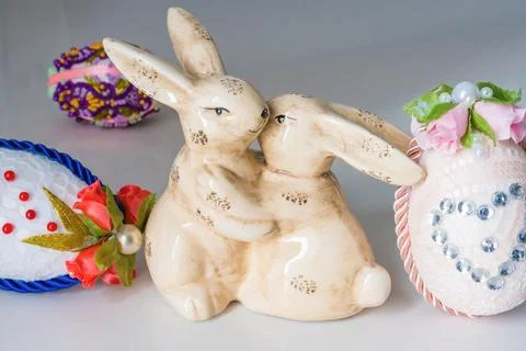 Easter decoration rustic hugging bunnies with handmade Easter eggs with flowers Stock Photos