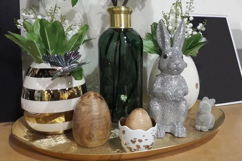 Easter decorations on the festive table, a vase with lilies of the valley, ra Stock Photos