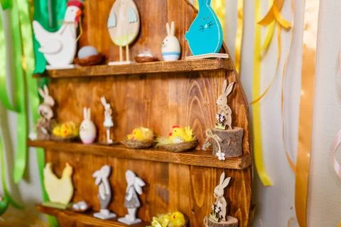 Easter decorative elements, painted eggs, wooden hen, bunny and chicken toys Stock Photos