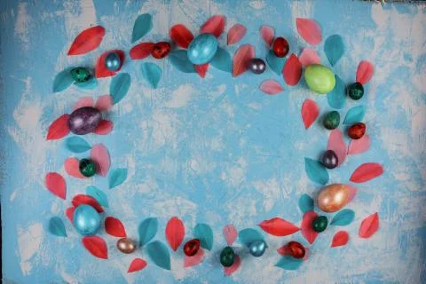 Easter decorative frame on the blue textured background. Stock Photos