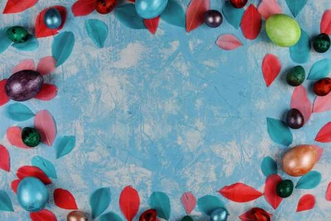 Easter decorative frame on the blue textured background. Stock Photos