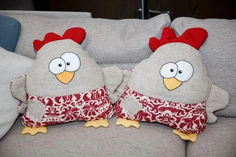 Easter decorative pillows in the shape of hens. 2 pillows chicken form for Fotos de archivo