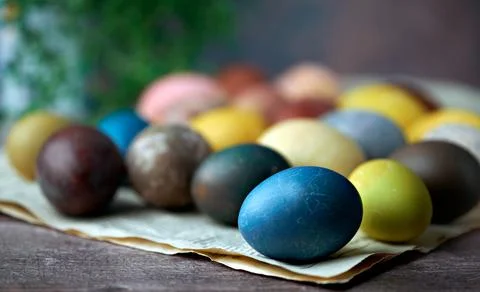 Easter. Defocused naturally colored eggs background. Selective focus Stock Photos