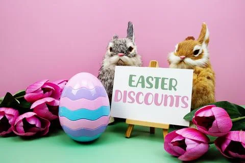 Easter Discounts text with easter elements decoration on pink and green bac.. Stockfoto's