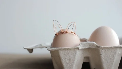 Easter DIY egg, made in bunny style. Minimal Easter concept Stock Footage 105871180