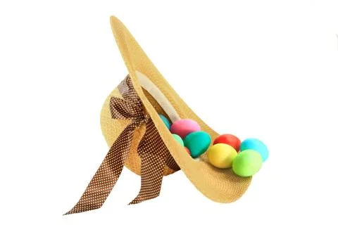 Easter dyed eggs in spring fashioned woman hat Stock Photos