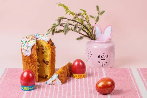 Easter. Easter cakes with eggs and bunny ears on a pink background. Easter. Stock Photos