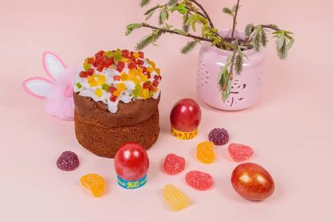 Easter. Easter cakes with eggs and bunny ears on a pink background. Easter. Stock Photos