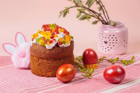 Easter. Easter cakes with eggs and bunny ears on a pink background. Easter. Stock Photos