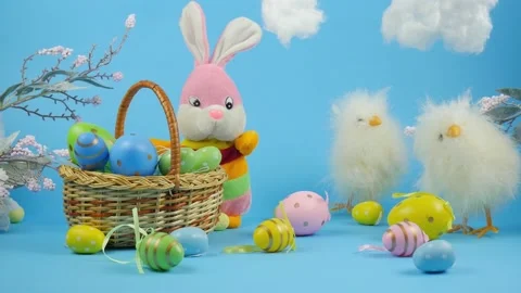 Easter. Easter card. Easter yellow chicks. Rabbit in a basket with Easter eggs Stock Footage 233183241