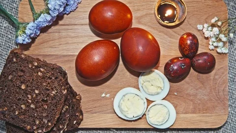 Easter, Easter eggs and bread are on the Board Video stock 73438222