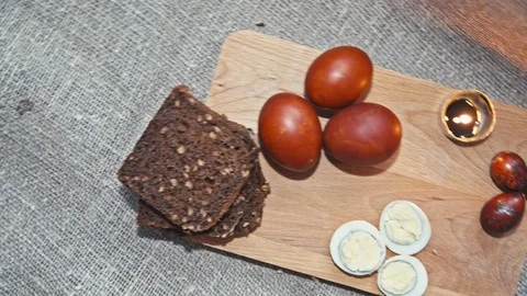 Easter, Easter eggs and bread are on the Board Stock Footage 73455312